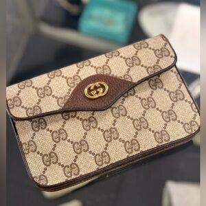 Pre Owned Gucci Monogram Mini Pouch with Gold GG Front